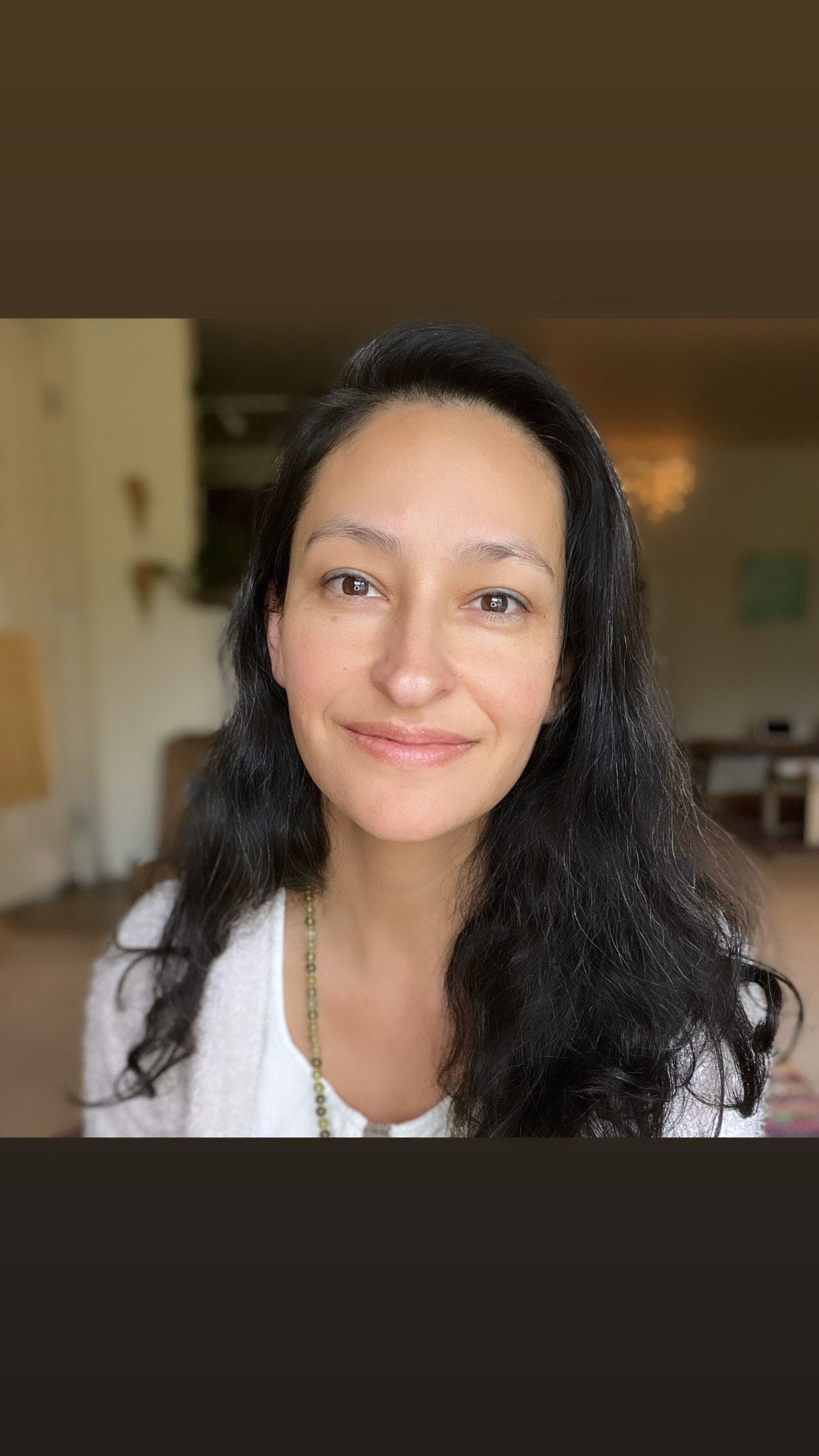 Portrait photo of Amarylis in her living room.